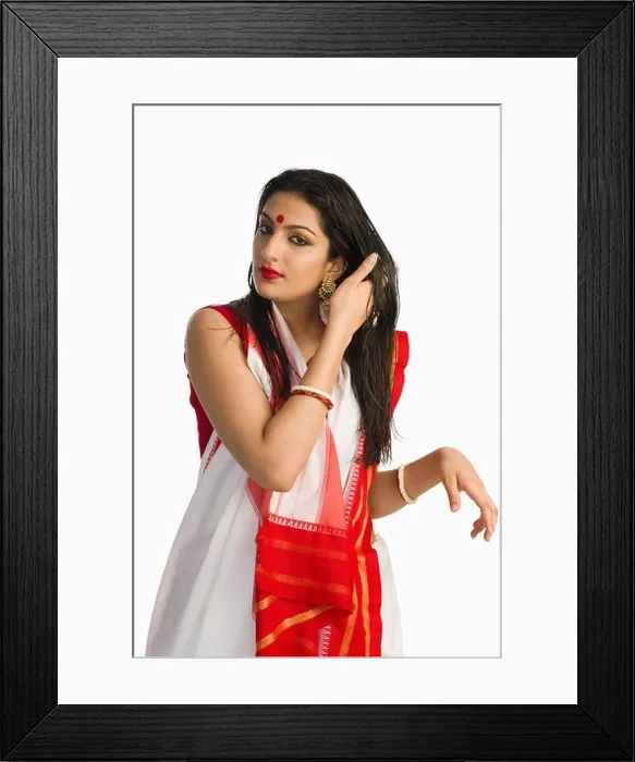 Framed Print : Woman in traditional Bengali saree with her hand in her hair Framed Print : Woman in traditional Bengali saree with her hand in her hair