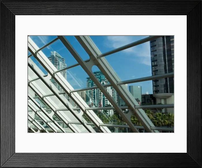 Framed Print : Buildings in downtown San Diego as seen through slanted glass wall in San Diego Convention Center Framed Print : Buildings in downtown San Diego as seen through slanted glass wall in San Diego Convention Center