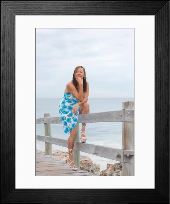 Framed Print : Portrait attractive looking mature woman standing confident and thoughtful alone outdoor, wearing summer dress and high heel shoes, with ocean and sky Framed Print : Portrait attractive looking mature woman standing confident and thoughtful alone outdoor, wearing summer dress and high heel shoes, with ocean and sky