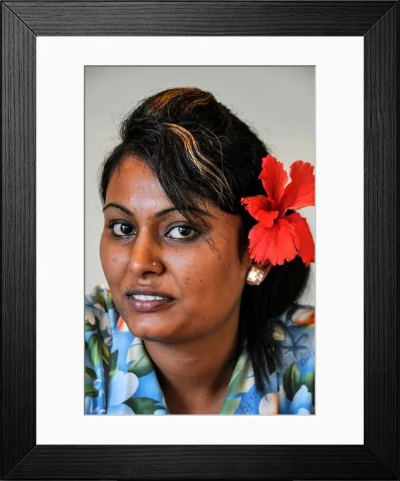 Framed Print : A young woman wearing a Red Hibiscus - a native flower of Fiji in the South Pacific Half of Fiji's population are of Asian decent Framed Print : A young woman wearing a Red Hibiscus - a native flower of Fiji in the South Pacific Half of Fiji's population are of Asian decent