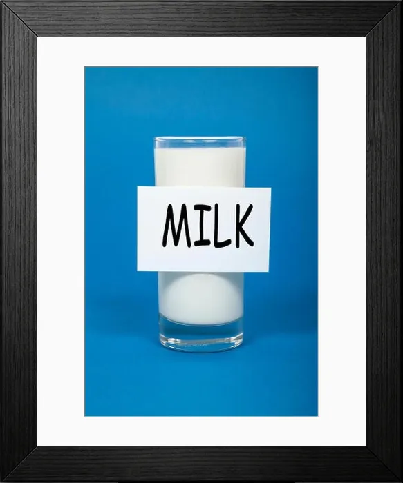 Framed Print : Milk written on sign of milk glass Framed Print : Milk written on sign of milk glass