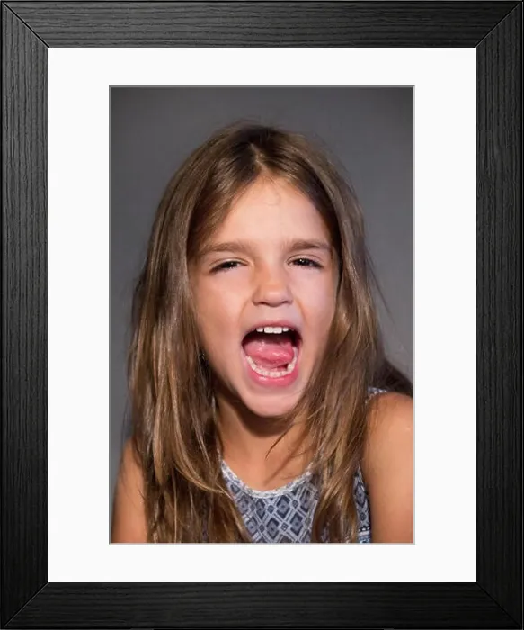 Framed Print : studio portrait girl screaming Framed Print : studio portrait girl screaming
