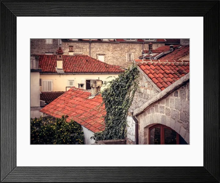Framed Print : Ancient building facade in old European city with orange tile roofs with antique exterior in retro vintage style Framed Print : Ancient building facade in old European city with orange tile roofs with antique exterior in retro vintage style