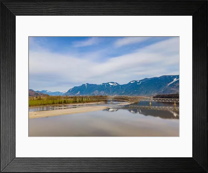 Framed Print : Fraser River close to the city of Agassiz with the Agassiz Rosedale Highway bridge and Mount Cheam on the background Framed Print : Fraser River close to the city of Agassiz with the Agassiz Rosedale Highway bridge and Mount Cheam on the background