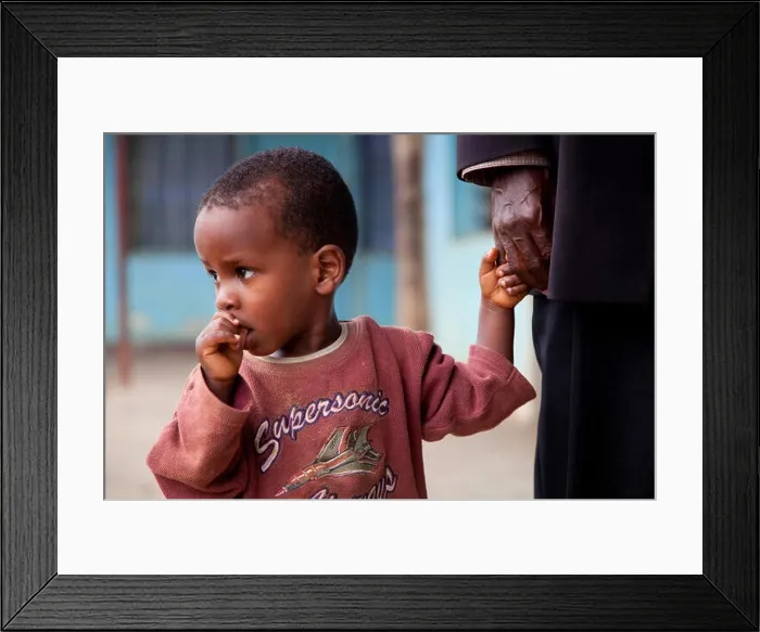 Framed Print : little boy at an old man's hand is sucking on his thumb, Burundi, Bujumbura Marie, Bujumbura Framed Print : little boy at an old man's hand is sucking on his thumb, Burundi, Bujumbura Marie, Bujumbura