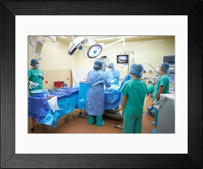 Framed Print : Surgical Team Working In Operating Theatre Framed Print : Surgical Team Working In Operating Theatre