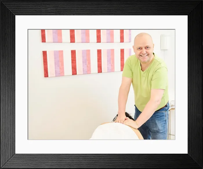 Framed Print : Massage, professional masseur and a woman customer Framed Print : Massage, professional masseur and a woman customer