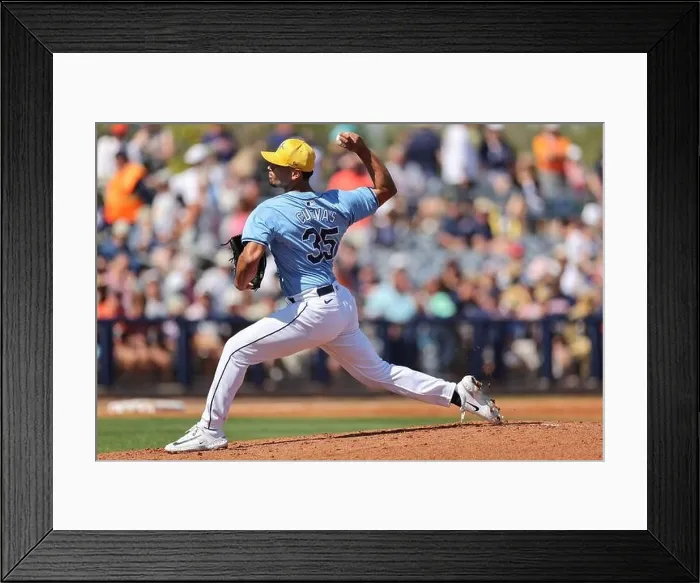 Framed Print : Port Charlotte, FL:Tampa Bay Rays pitcher Jonny Cuevas (35) delivers a pitch during an MLB spring training game against the Detroit Tigers on February Framed Print : Port Charlotte, FL:Tampa Bay Rays pitcher Jonny Cuevas (35) delivers a pitch during an MLB spring training game against the Detroit Tigers on February