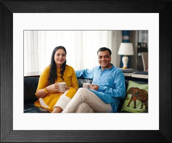Framed Print : Happy Indian Couple Drinking Tea Framed Print : Happy Indian Couple Drinking Tea