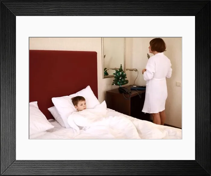 Framed Print : Mother with son in hotel room in morning Framed Print : Mother with son in hotel room in morning