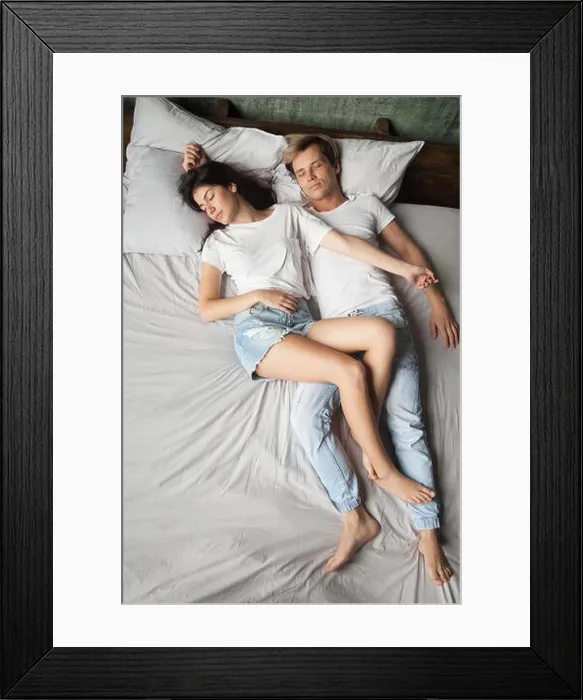 Framed Print : Young girlfriend fell asleep on top of boyfriend in bed Framed Print : Young girlfriend fell asleep on top of boyfriend in bed