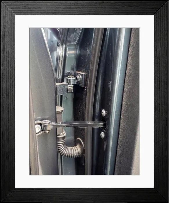 Framed Print : close up of typical auto car door hinge and mechanical and electrical connections detail Framed Print : close up of typical auto car door hinge and mechanical and electrical connections detail
