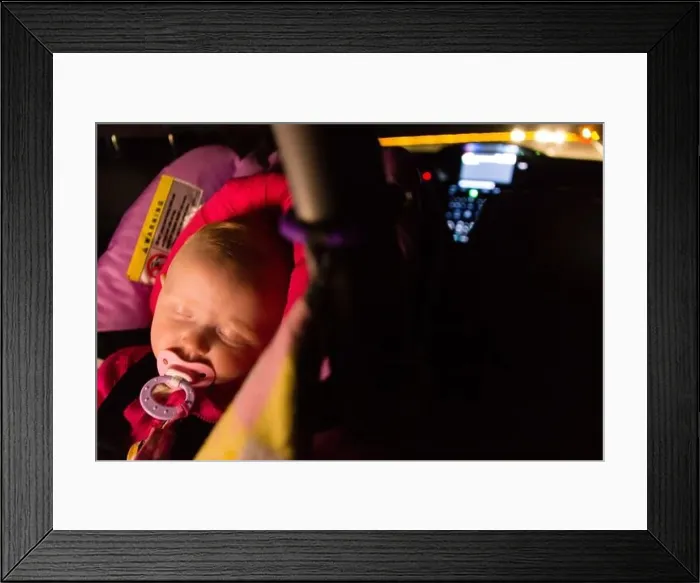 Framed Print : Five-month-old baby asleep in a car seat during a night drive Framed Print : Five-month-old baby asleep in a car seat during a night drive