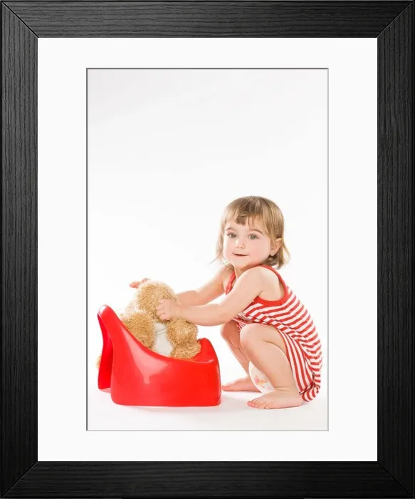 Framed Print : baby girl putting on potty teddy bear Framed Print : baby girl putting on potty teddy bear