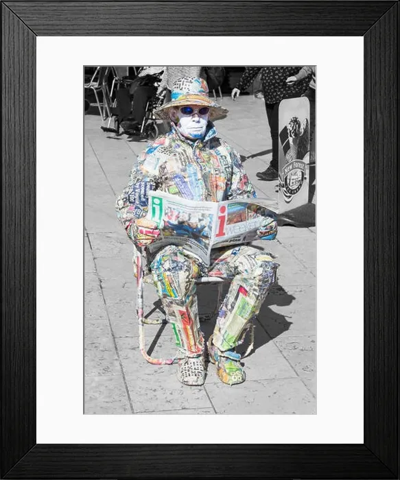 Framed Print : Living statue man covered in strips of newspaper sat reading paper in Bournemouth Square, Bournemouth, Dorset UK in September Framed Print : Living statue man covered in strips of newspaper sat reading paper in Bournemouth Square, Bournemouth, Dorset UK in September
