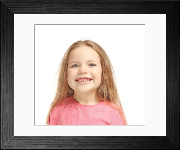 Framed Print : Little girl training pronounce letters on white background