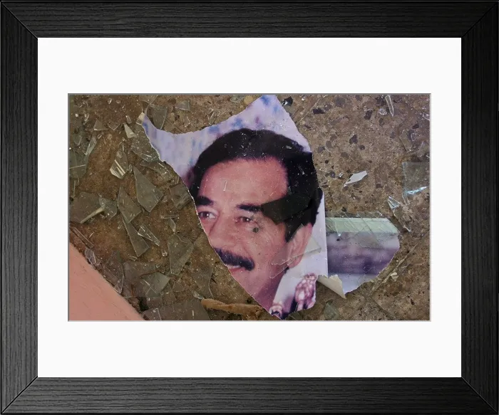 Framed Print : a portrait of deposed iraqi dictator saddam hussein is torn and discarded in a government building on the outskirts of mosul Framed Print : a portrait of deposed iraqi dictator saddam hussein is torn and discarded in a government building on the outskirts of mosul