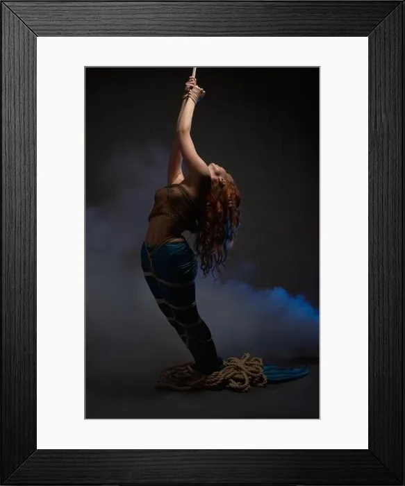 Framed Print : Suffering mermaid trapped in net with smoke in studio Framed Print : Suffering mermaid trapped in net with smoke in studio