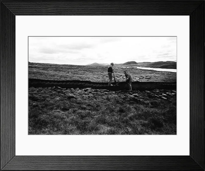 Framed Print : Men cutting peat on a stretch of land on the island of Lewis in the Outer Hebrides, Scotland Framed Print : Men cutting peat on a stretch of land on the island of Lewis in the Outer Hebrides, Scotland