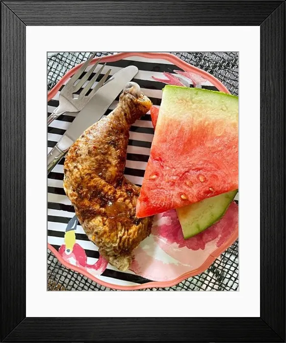 Framed Print : A light summer meal of fried chicken and watermelon slices on a festive black and white striped plate, USA Framed Print : A light summer meal of fried chicken and watermelon slices on a festive black and white striped plate, USA