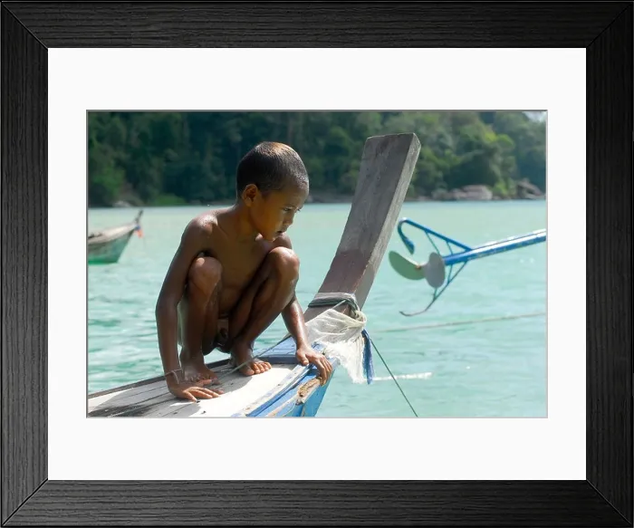 Framed Print : Child, boy, crouching on a boat, Chao Naam, Moken, Surin Islands Marine National Park, Ko Surin Noi, Phang Nga, Thailand Framed Print : Child, boy, crouching on a boat, Chao Naam, Moken, Surin Islands Marine National Park, Ko Surin Noi, Phang Nga, Thailand