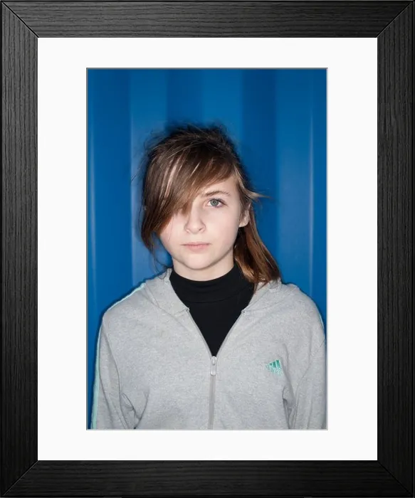 Framed Print : A 12 13 year old teenage girl with attitude - lit using direct harsh on-camera ring flash Framed Print : A 12 13 year old teenage girl with attitude - lit using direct harsh on-camera ring flash