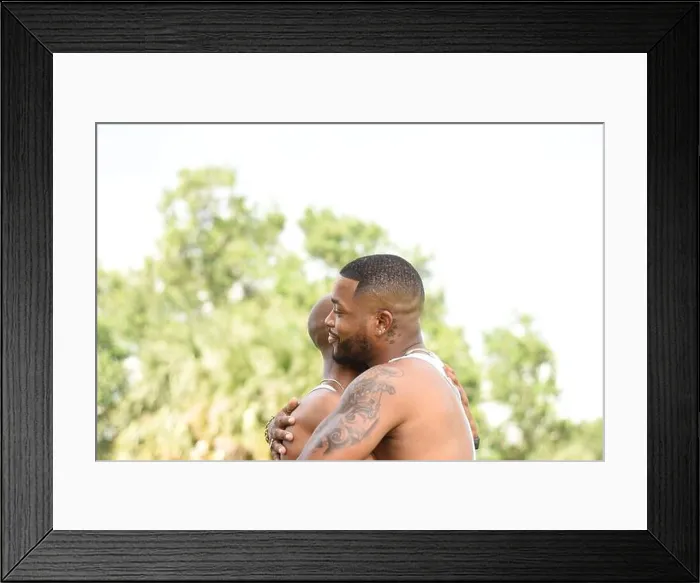 Framed Print : USA, Louisiana, Gay couple embracing in park Framed Print : USA, Louisiana, Gay couple embracing in park