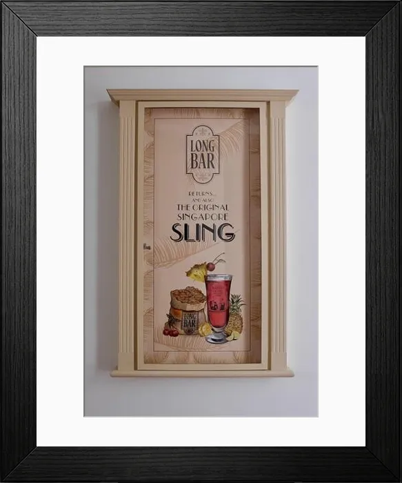 Framed Print : New poster announcing reopening of Long Bar, Raffles Hotel, Singapore on August 2019, home of the iconic Singapore Sling cocktail after restoration Framed Print : New poster announcing reopening of Long Bar, Raffles Hotel, Singapore on August 2019, home of the iconic Singapore Sling cocktail after restoration
