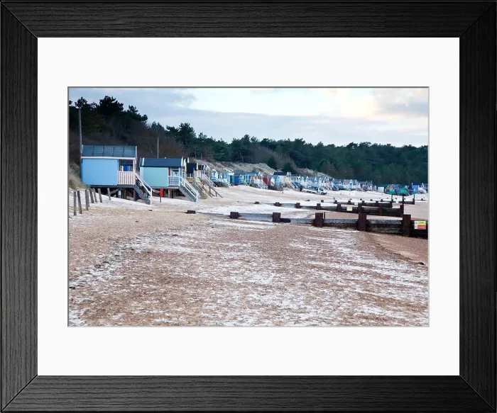 Framed Print : The famous beach huts at Wells-next-the-Sea snow covered in winter North Norfolk UK