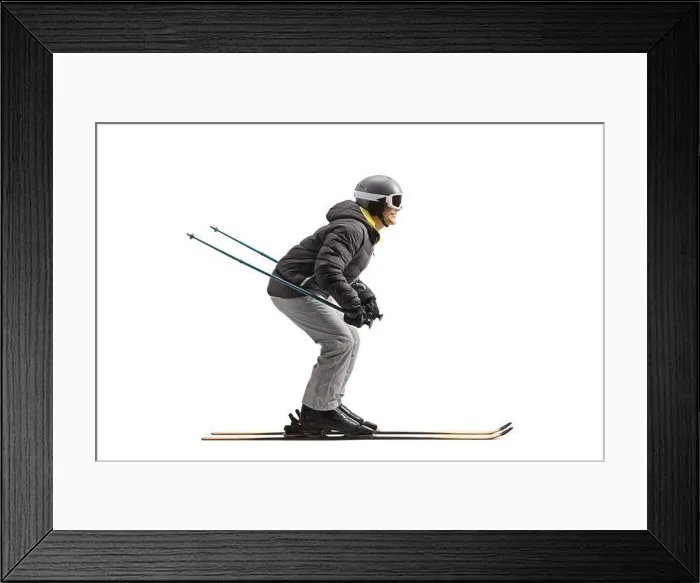 Framed Print : Full length profile shot of a man skiing isolated on a white background Framed Print : Full length profile shot of a man skiing isolated on a white background