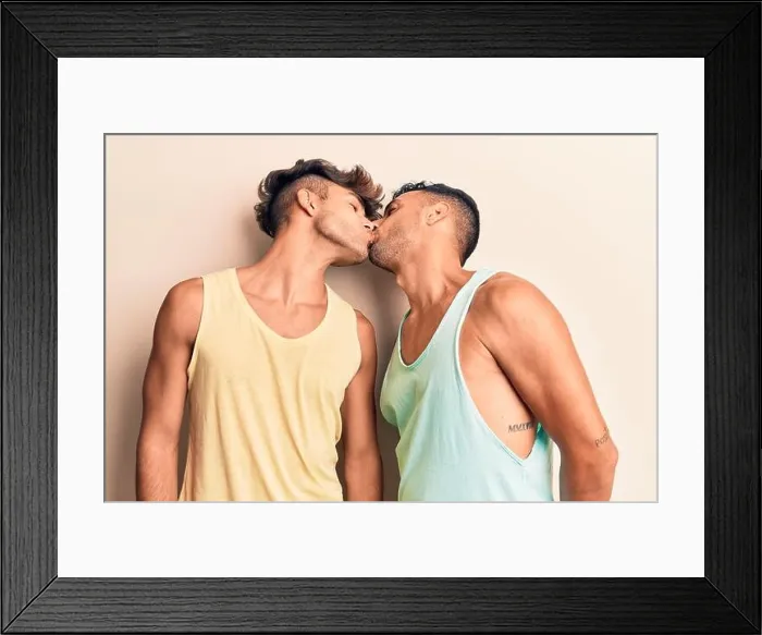 Framed Print : Young couple of men wearing summer clothes. Standing with smile on face kissing over isolated white background Framed Print : Young couple of men wearing summer clothes. Standing with smile on face kissing over isolated white background