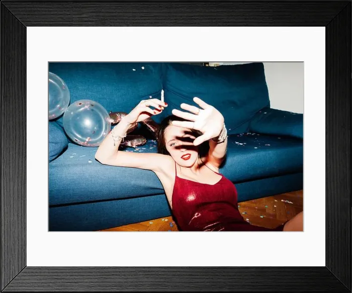 Framed Print : Young woman celebrating her 21st birthday illuminated with hard flash light Framed Print : Young woman celebrating her 21st birthday illuminated with hard flash light