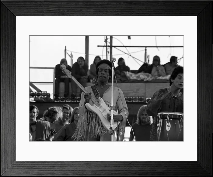 Framed Print : Jimi Hendrix performing his legendary 2 hour performance at Woodstock Music & Arts Festival held on Sam Yasgur's alfalfa field in Sullivan County in
