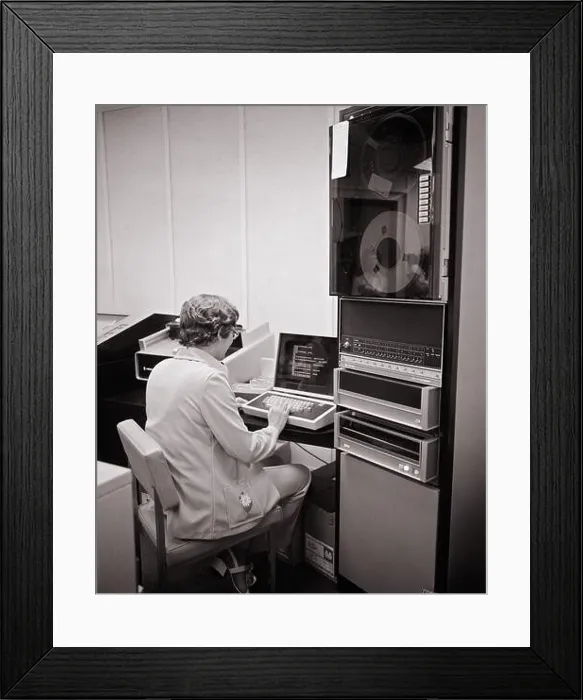 Framed Print : 1970s BACK VIEW OF WOMAN SITTING WORKING AT COMPUTER WORKSTATION NEXT TO A REEL TO REEL STORAGE COLUMN - o4229 HAR001 HARS SKILLS NETWORKING COLUMN Framed Print : 1970s BACK VIEW OF WOMAN SITTING WORKING AT COMPUTER WORKSTATION NEXT TO A REEL TO REEL STORAGE COLUMN - o4229 HAR001 HARS SKILLS NETWORKING COLUMN