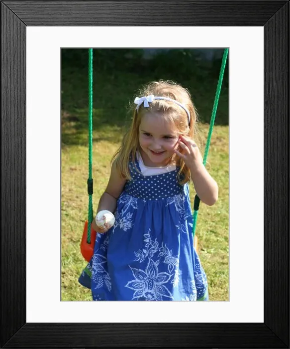 Framed Print : Little blonde girl, child kid brown eyes swinging swing eating ice cream cone on a sunny summers day summer concept beautiful child time of her life Framed Print : Little blonde girl, child kid brown eyes swinging swing eating ice cream cone on a sunny summers day summer concept beautiful child time of her life