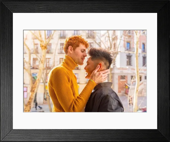 Framed Print : Beautiful gay couple being romantic at home on the sofa, home balcony kissing each other on the forehead, lgbt concept Framed Print : Beautiful gay couple being romantic at home on the sofa, home balcony kissing each other on the forehead, lgbt concept