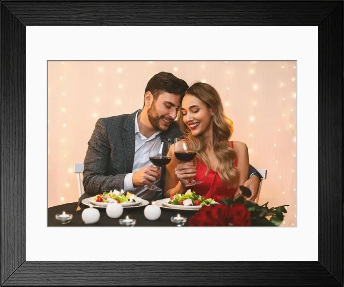 Framed Print : Romantic couple in love having date in restaurant, celebrating anniversary Framed Print : Romantic couple in love having date in restaurant, celebrating anniversary