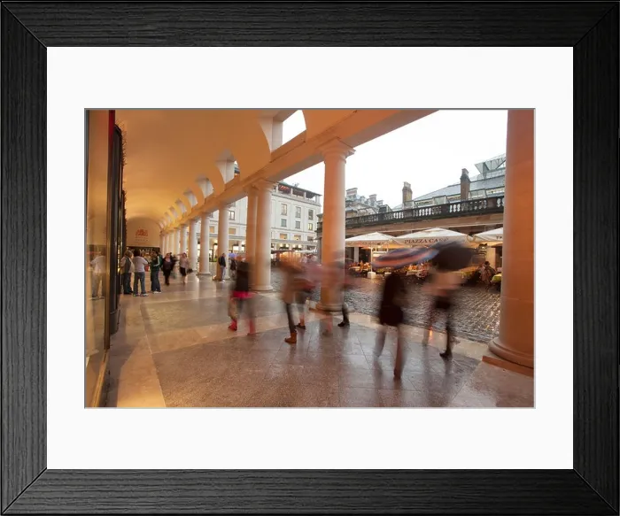Framed Print : A view of people walking under the arches at Covent Garden during a rain shower Framed Print : A view of people walking under the arches at Covent Garden during a rain shower