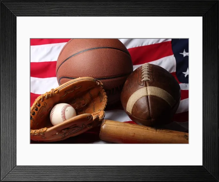 Framed Print : A studio shot of an American Football, a basketball and a baseball ball, mitt and bat Framed Print : A studio shot of an American Football, a basketball and a baseball ball, mitt and bat