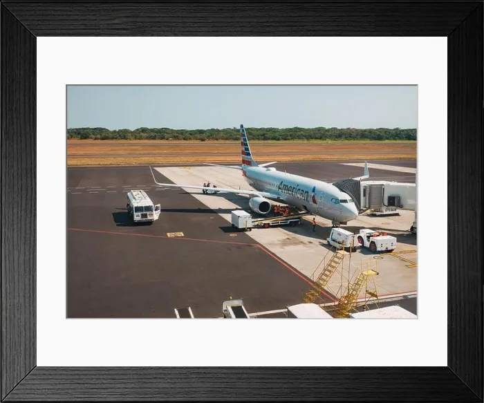 Framed Print : an American Airlines Boeing 737 jet on the ground at El Salvador International Airport, El Salvador Framed Print : an American Airlines Boeing 737 jet on the ground at El Salvador International Airport, El Salvador
