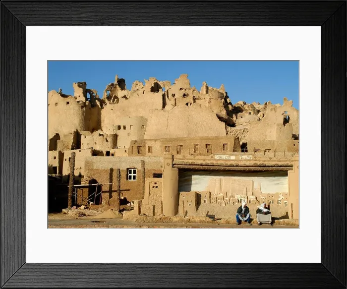 Framed Print : Two men sitting in front of the old town of Shiwa Egypt 2007 Framed Print : Two men sitting in front of the old town of Shiwa Egypt 2007