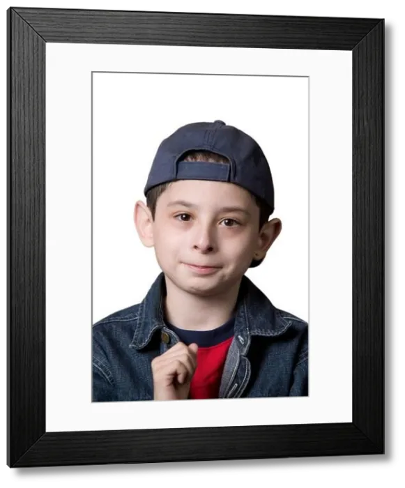 Framed Print : Portrait of a young Caucasian boy wearing a backwards facing baseball cap on a white background Framed Print : Portrait of a young Caucasian boy wearing a backwards facing baseball cap on a white background