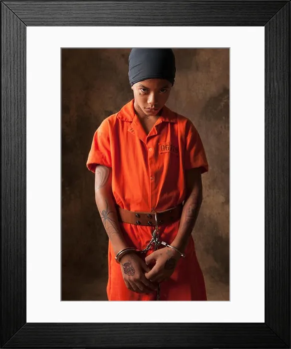 Framed Print : Boy in prisoner jumpsuit and handcuffs Framed Print : Boy in prisoner jumpsuit and handcuffs