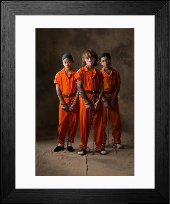 Framed Print : Boys in prisoner jumpsuits and handcuffs