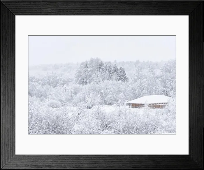 Framed Print : Wooden house in a snowy winter forest. Concept cottagecore and slowing-down. Copy space Framed Print : Wooden house in a snowy winter forest. Concept cottagecore and slowing-down. Copy space