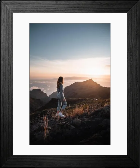 Framed Print : Young woman with urban outfit looking at a beautiful sunset from the top of Teno on the canary island of Tenerife during her tourist vacation Framed Print : Young woman with urban outfit looking at a beautiful sunset from the top of Teno on the canary island of Tenerife during her tourist vacation