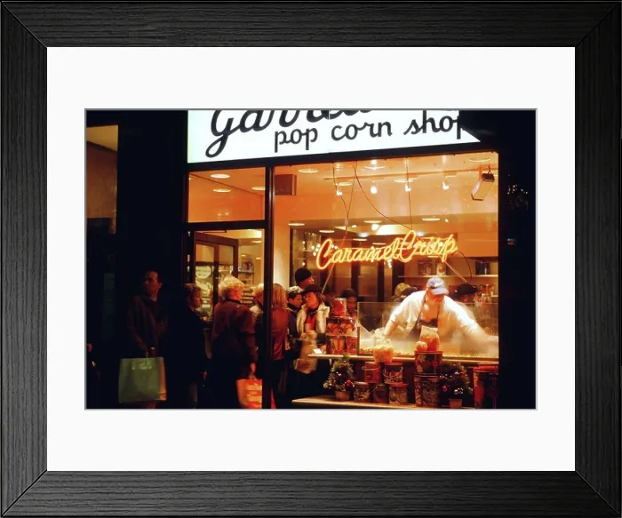 Framed Print : NIGHT Chicago Illinois Garretts popcorn shop on Michigan Avenue customers in line man scoop caramel corn