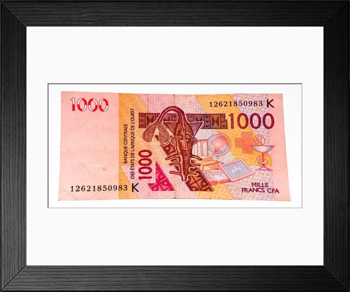 Framed Print : 1000 CFA franc bank note. CFA franc is used in 14 African countries Framed Print : 1000 CFA franc bank note. CFA franc is used in 14 African countries