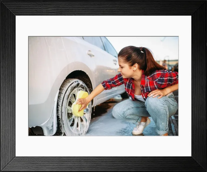 Framed Print : Cute woman with sponge scrubbing vehicle wheel with foam, car wash. Lady on self-service automobile washing. Outdoor carwash at summer day Framed Print : Cute woman with sponge scrubbing vehicle wheel with foam, car wash. Lady on self-service automobile washing. Outdoor carwash at summer day
