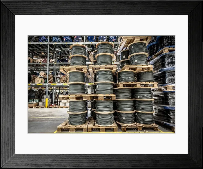 Framed Print : Cable drums stacked on pallets in warehouse Framed Print : Cable drums stacked on pallets in warehouse
